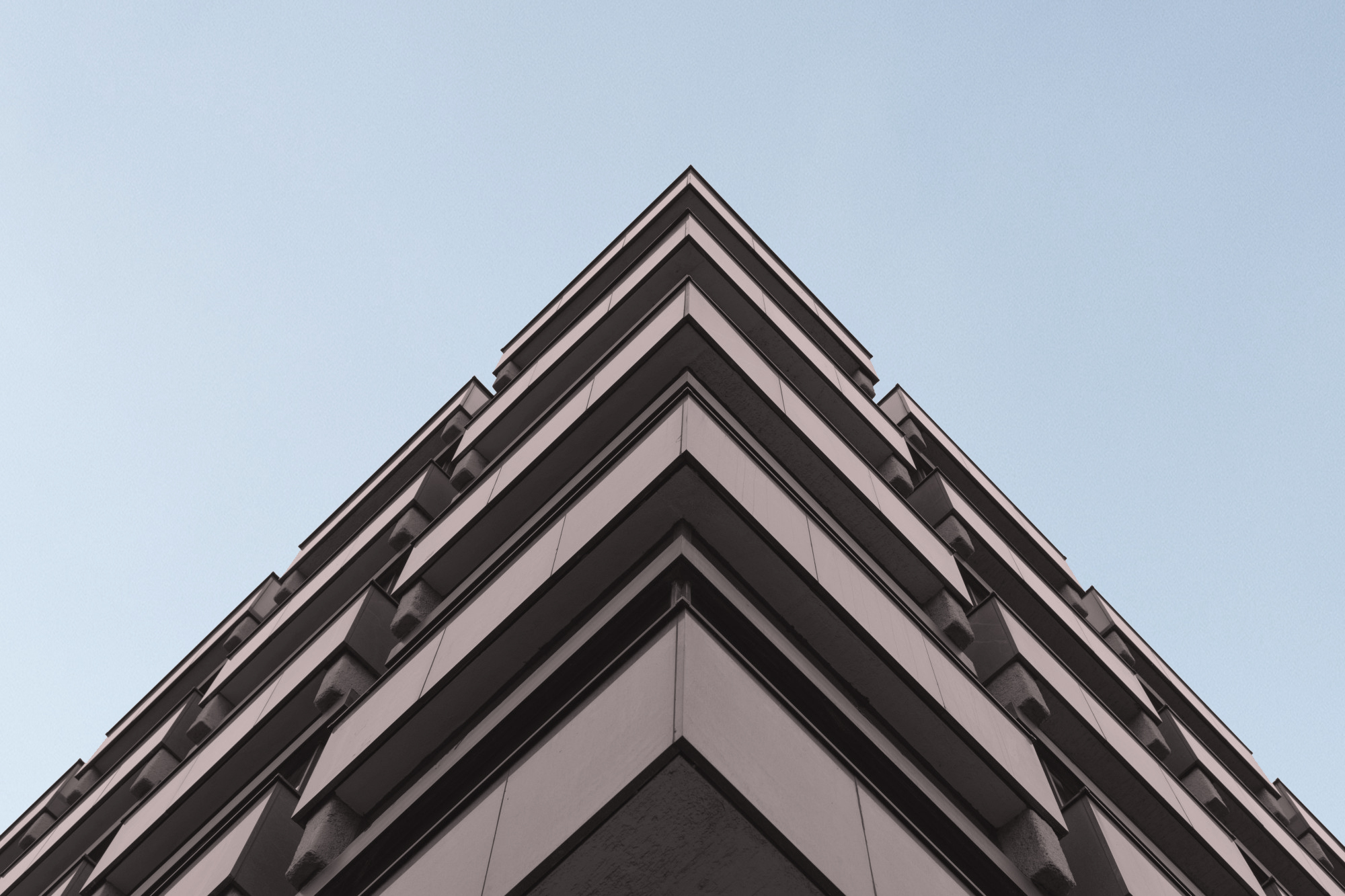 low-angle-shot-grey-concrete-building-representing-modern-arcmhitecture